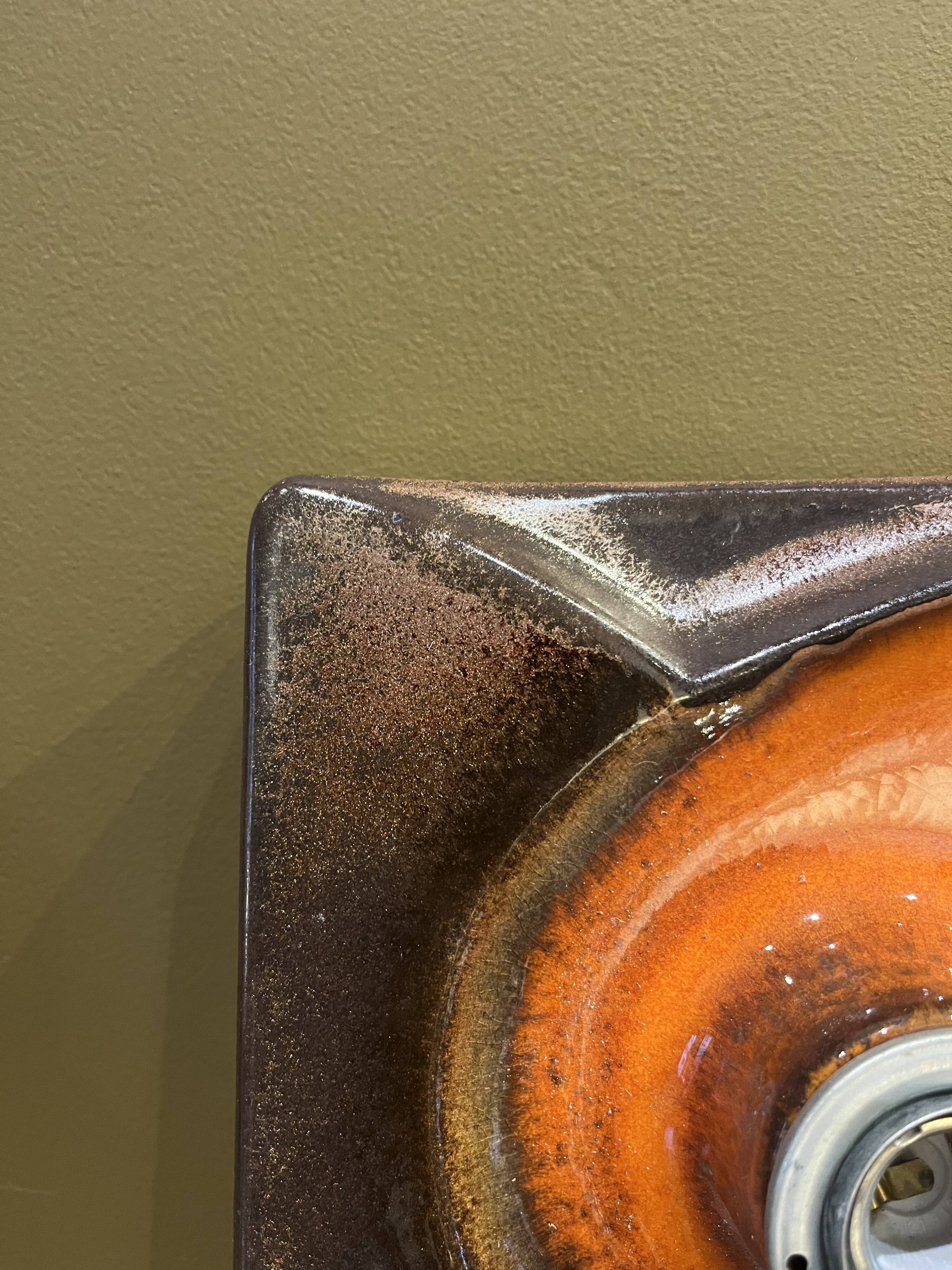 Pair of square ceramic wall sconces.