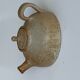 Vintage teapot in reeds