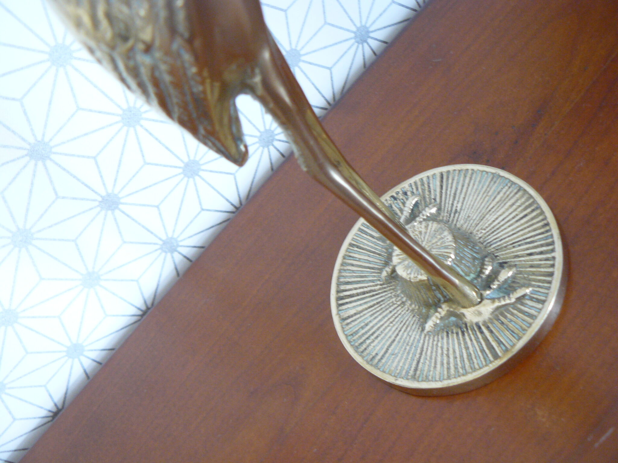 Heron in vintage brass