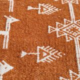 White and brown kilim carpet with gazelle patterns