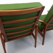 Pair of vintage Scandinavian armchairs in teak and green fabric from the 1960s.