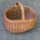 Round oval basket in rattan and woven wicker with handle