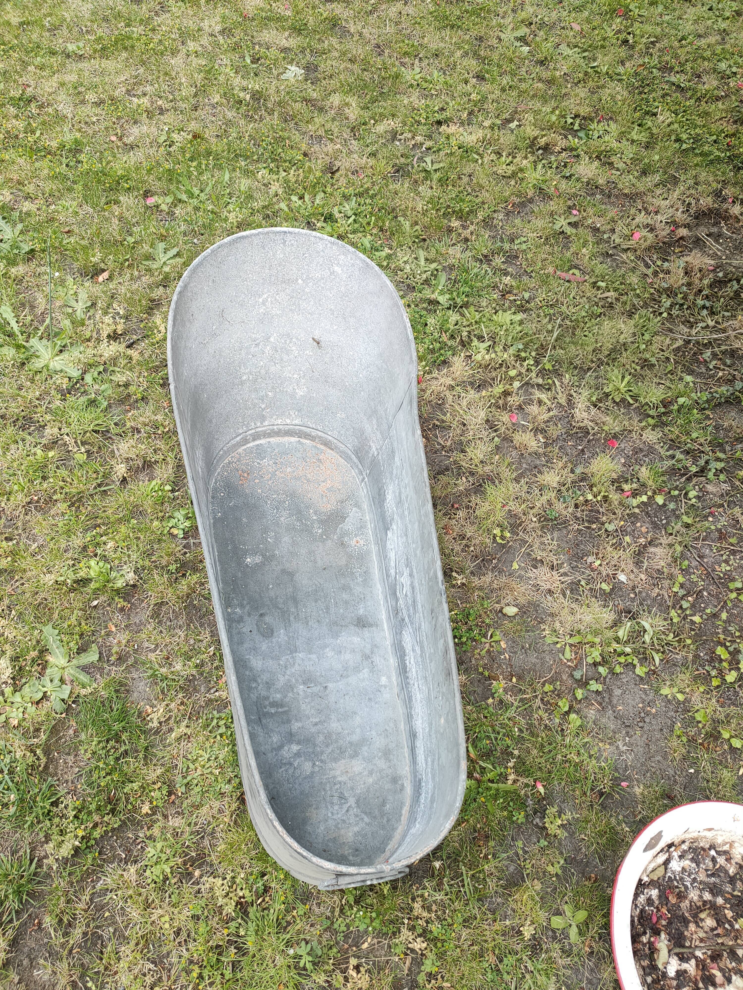 Antique children's bathtub in zinc