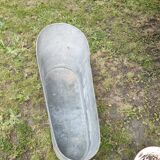 Antique children's bathtub in zinc