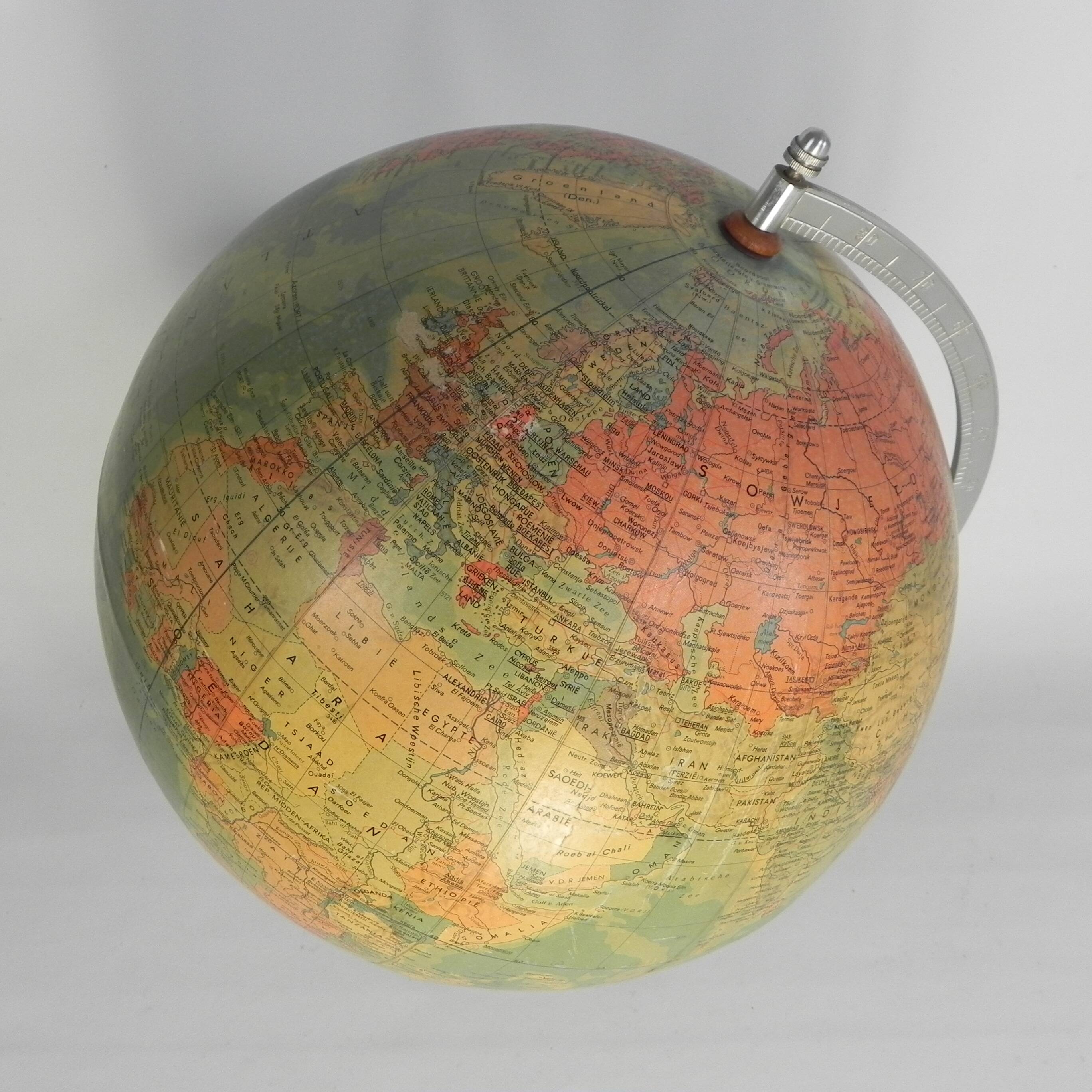 Paper mache globe on a wooden base, 1975