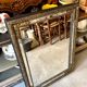 Rectangular Napoleon III mirror in moulded black and gold wood with engraved mirror decoration.