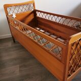 Rattan bed with compass feet