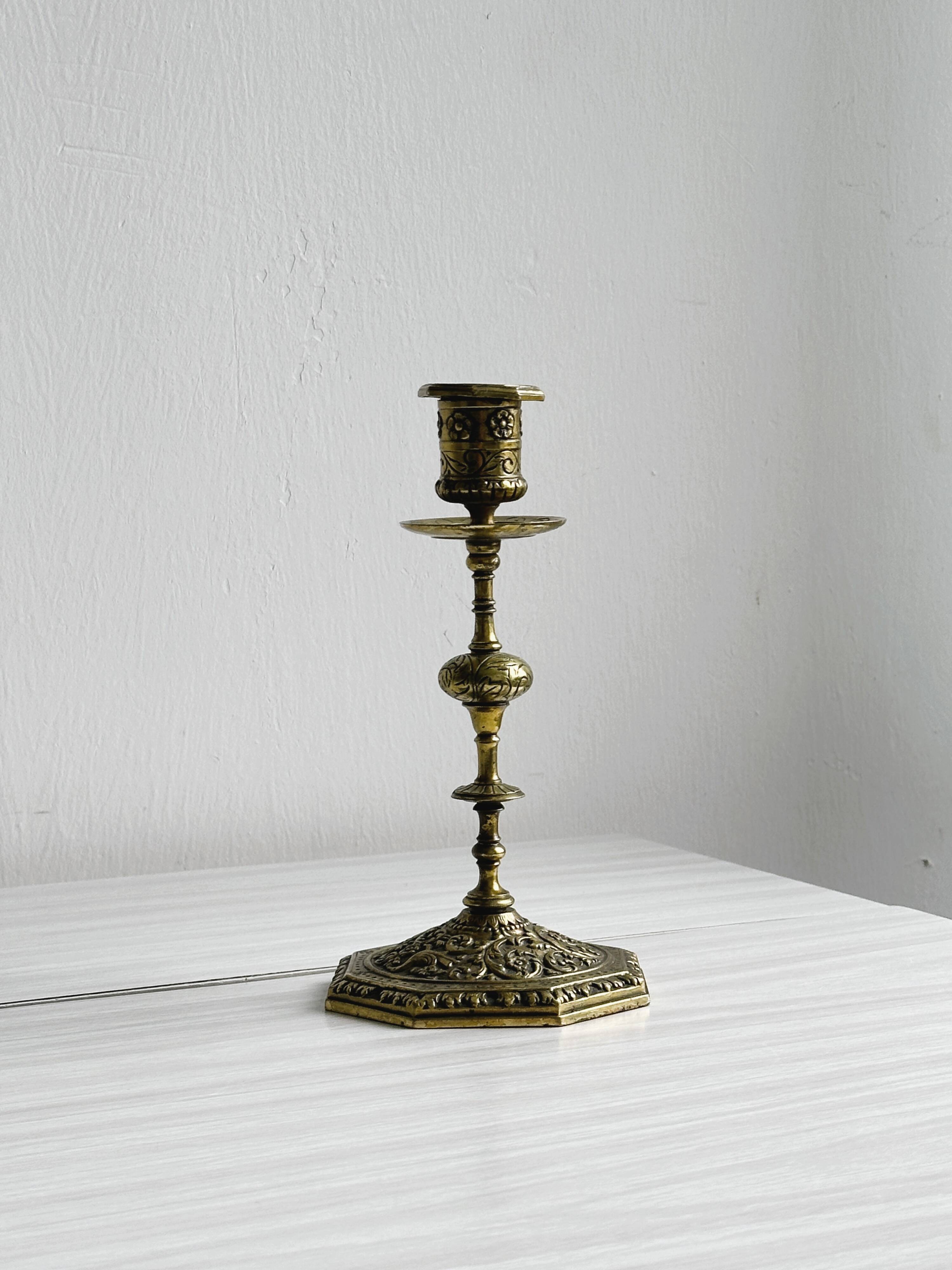 Carved brass candlestick holder