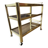 Serving table with wheels, gold-plated brass, smoked glass