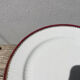 6 flat plates in gilded porcelain and burgundy
