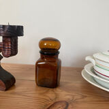 Old apothecary bottle in brown glass / jar
