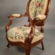 Pair of Louis Philippe armchairs with petit point upholstery.