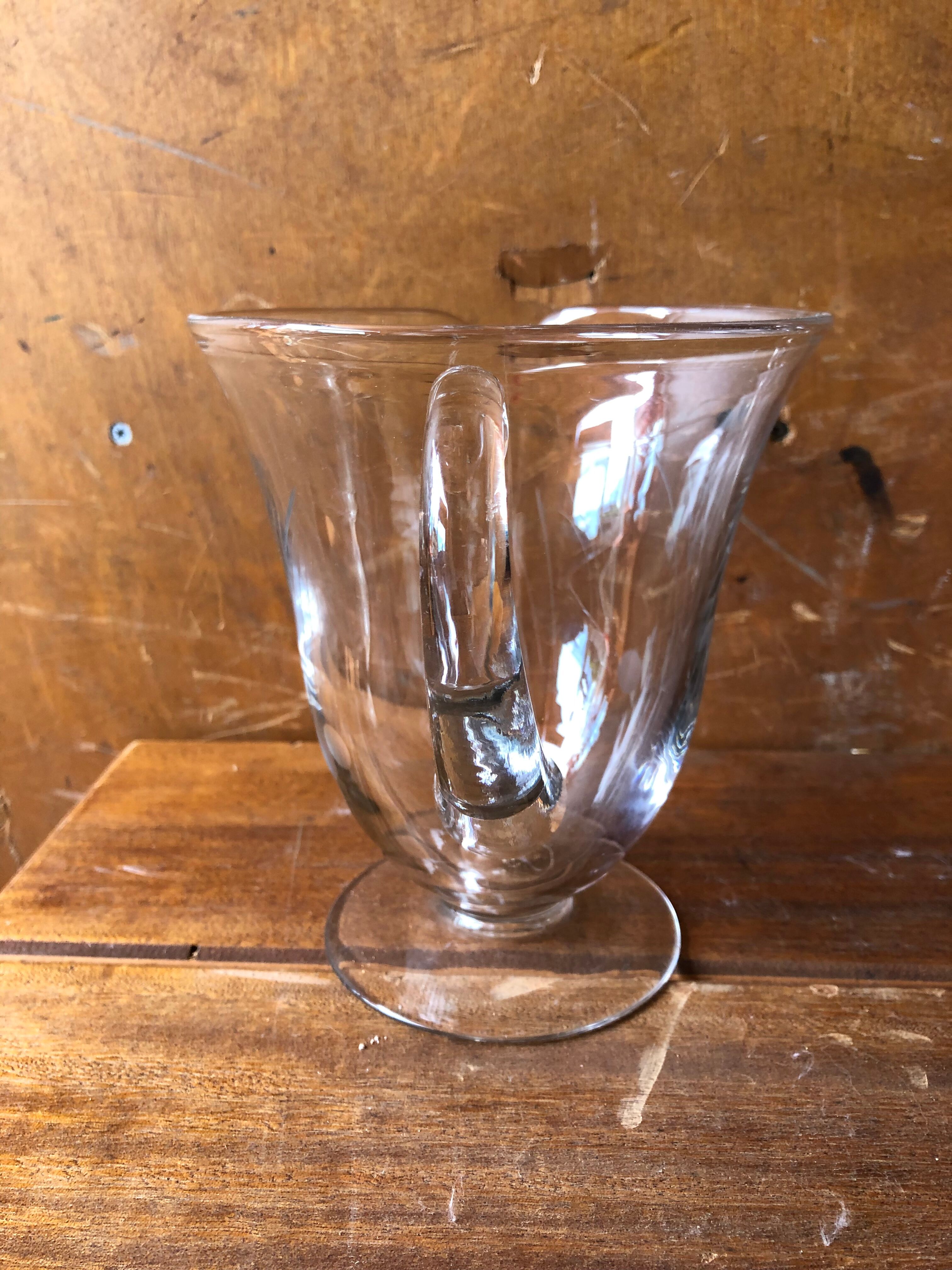 Old pitcher service and 5 foot glasses in engraved glass vintage table art