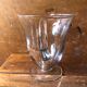 Old pitcher service and 5 foot glasses in engraved glass vintage table art