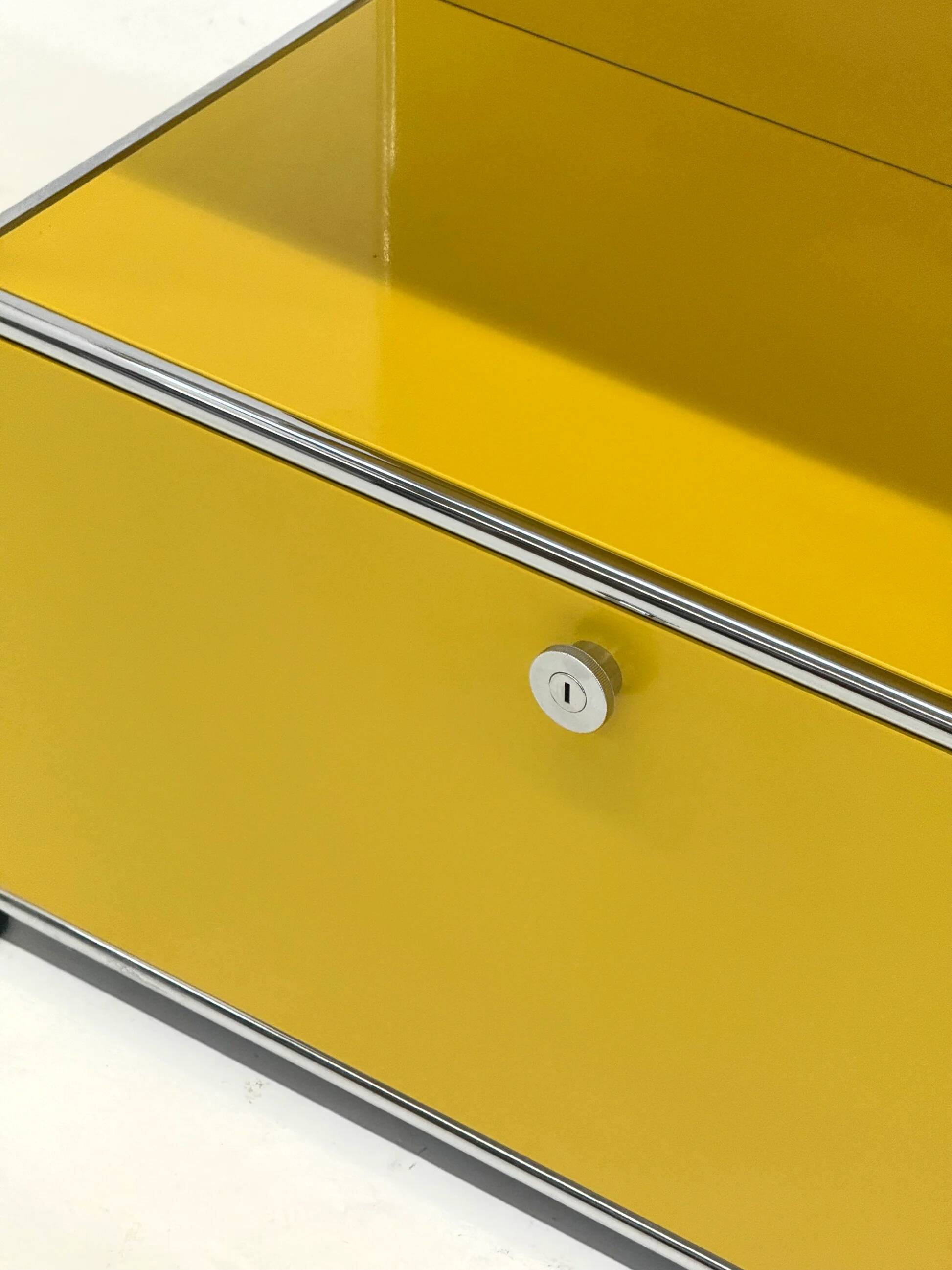USM Haller cabinet in yellow