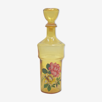 Vintage yellow decanter with pink patterns