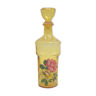 Vintage yellow decanter with pink patterns