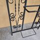 Large vintage wall coat rack in wrought iron with mirror and shelf.