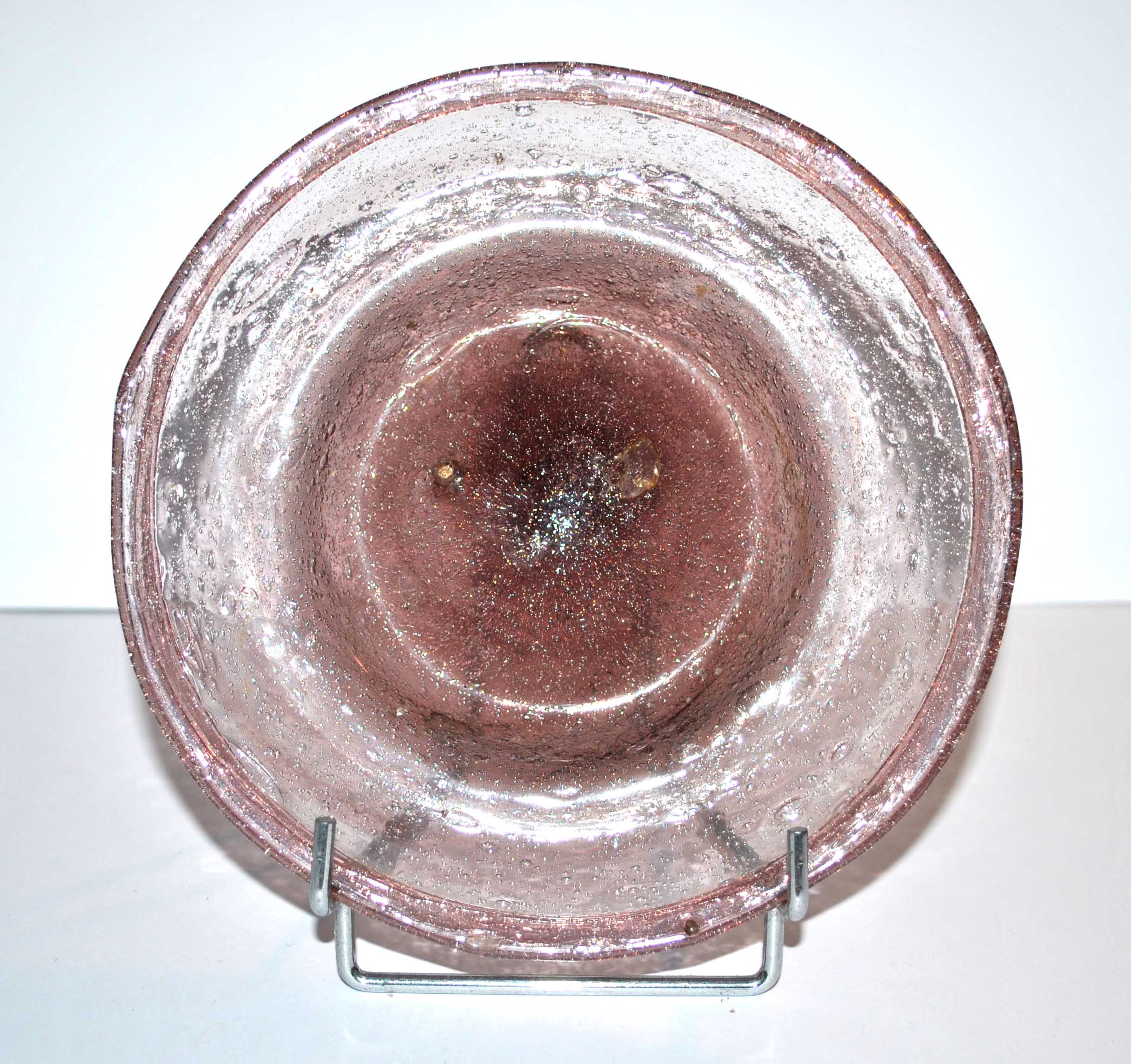 Antique plate in pink bubbled blown glass