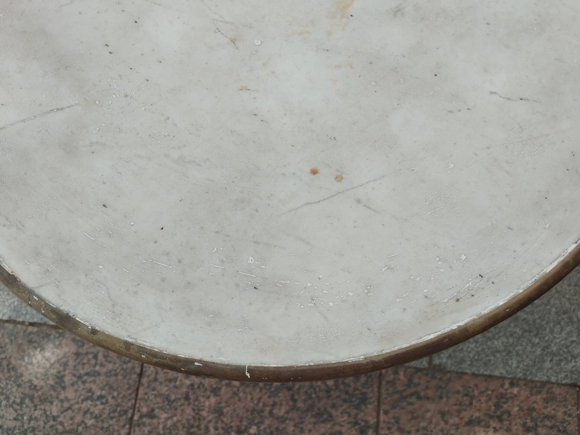 Old bistro table with marble top and cast iron base.