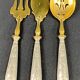 Suite of 3 dessert service elements with silver handles and sprinkler spoon