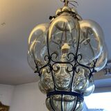 Blown glass and metal lantern