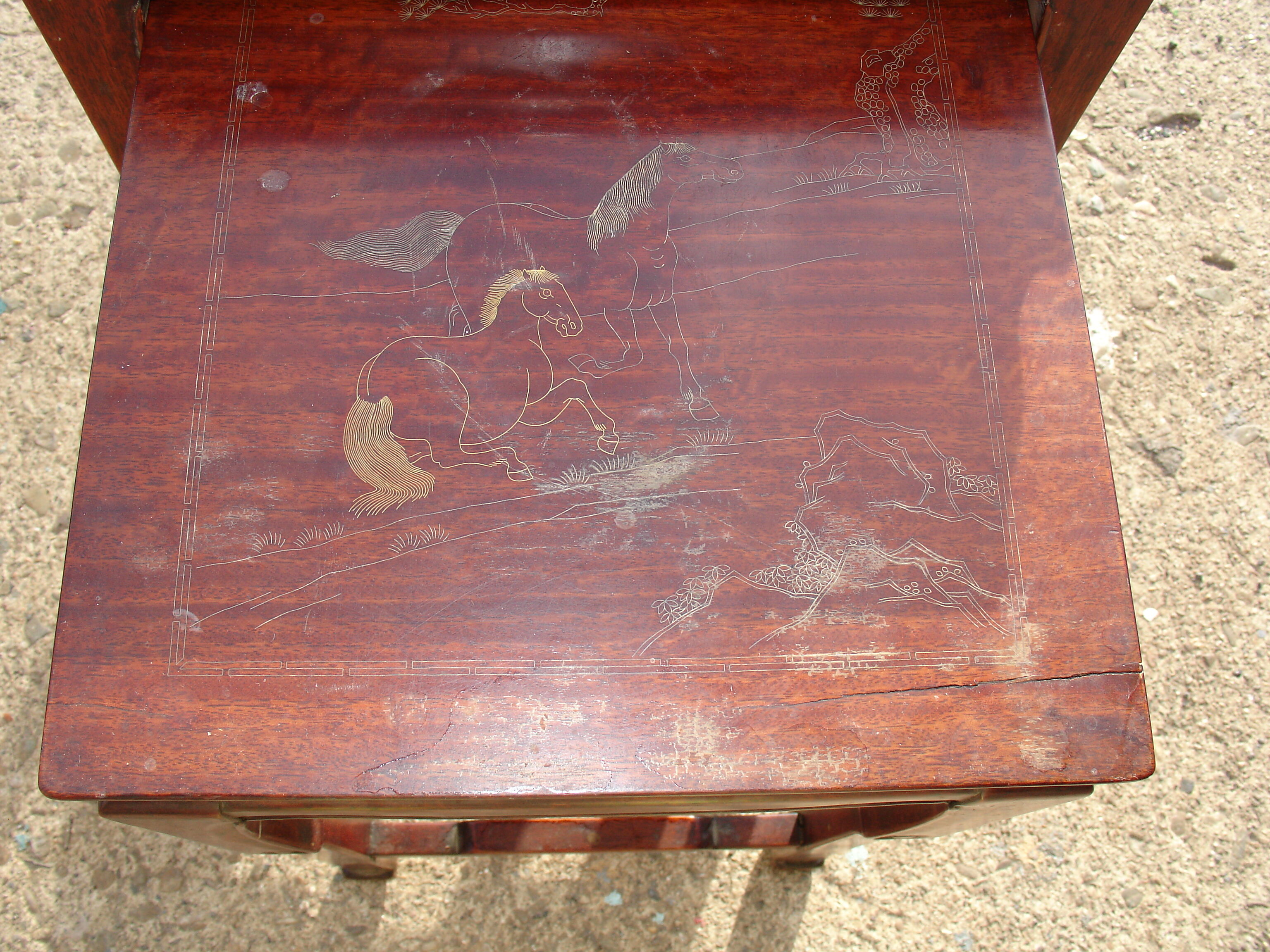 Nesting tables in ironwood with engraved decoration and gold highlights