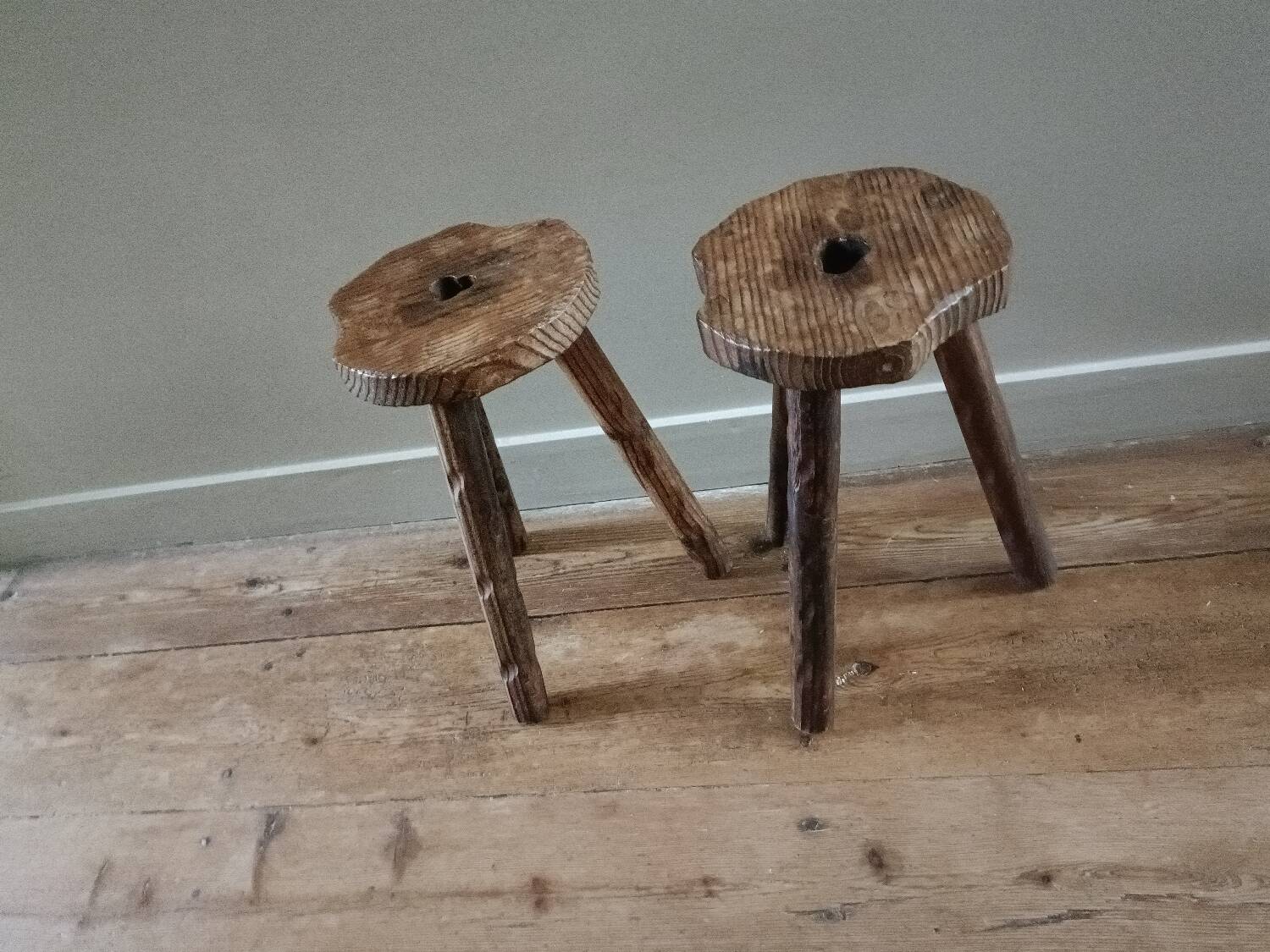 A pair of tripod stools
