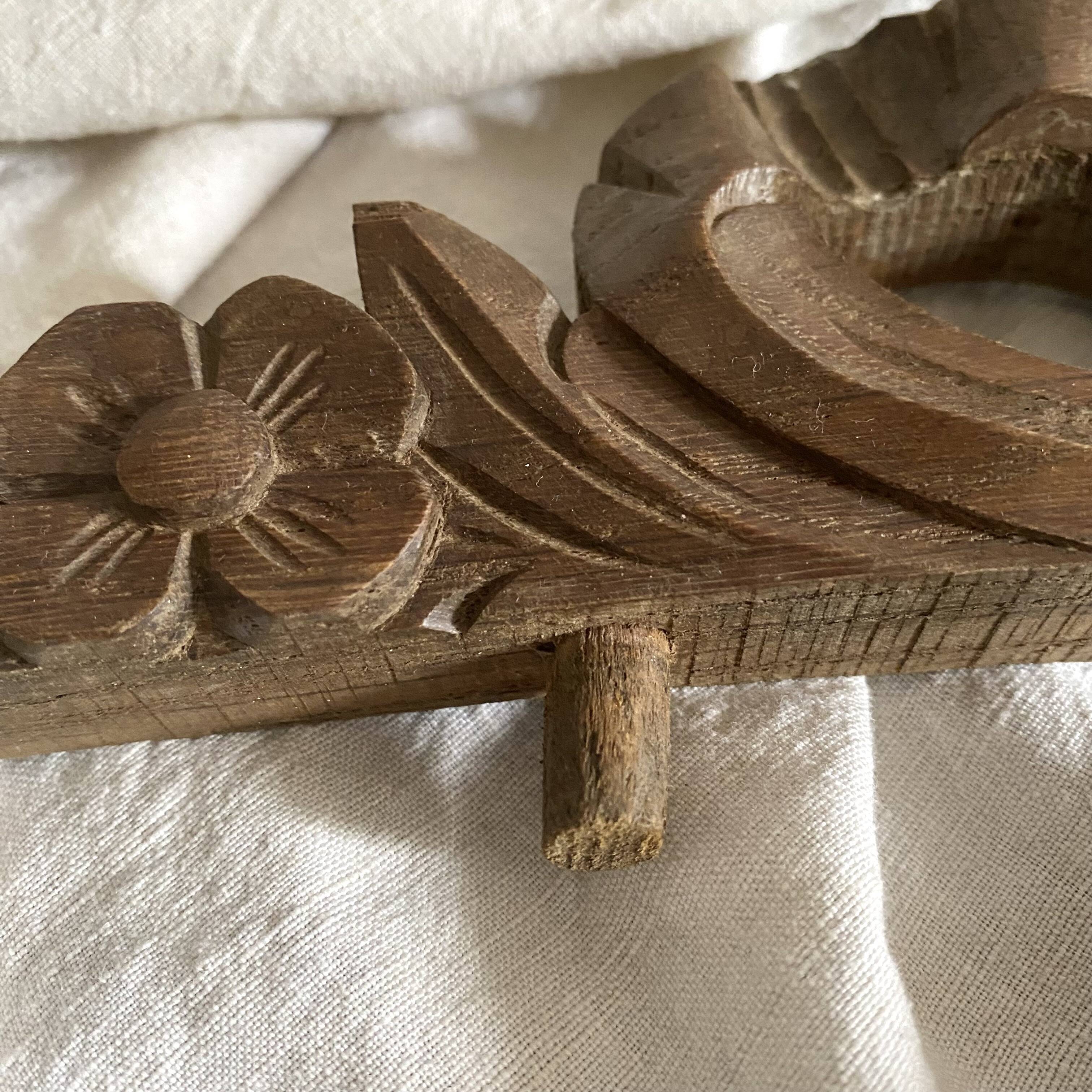 Antique carved wooden ribbon pediment
