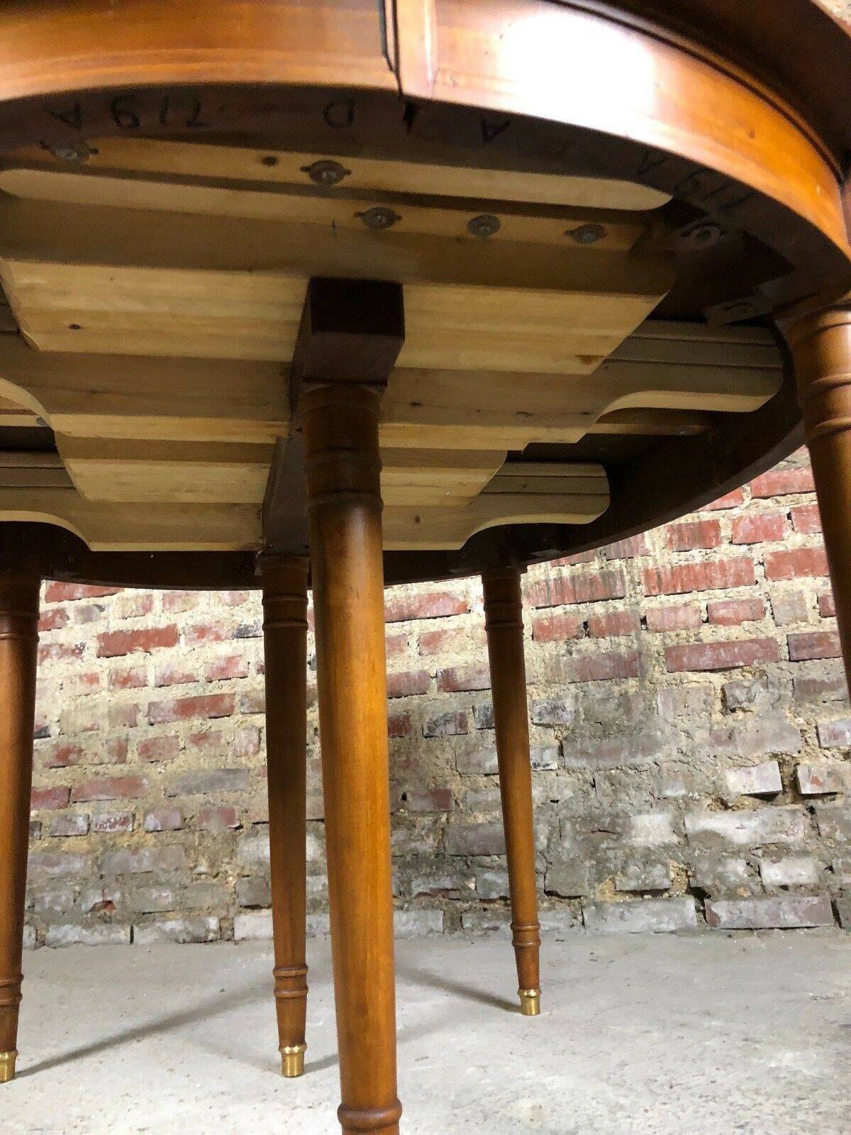 Oval walnut table with 6 legs from 1m12 to 2.94 (4 extensions of 45.5 cm)