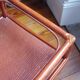 Varnished rattan coffee table and smoked glass top