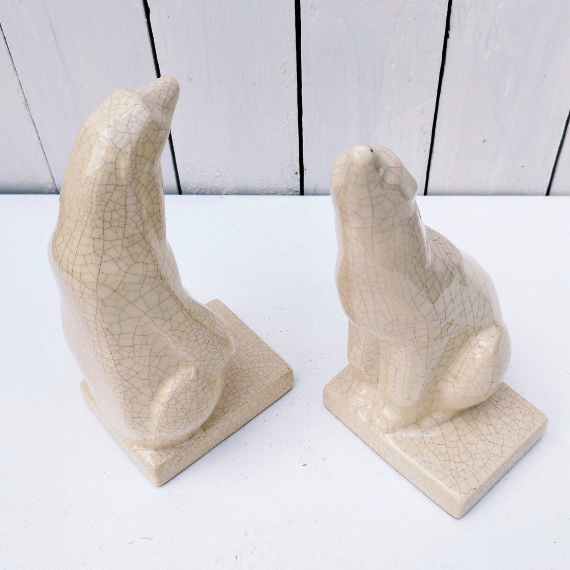 Cracked ceramic bookends with a couple of bears
