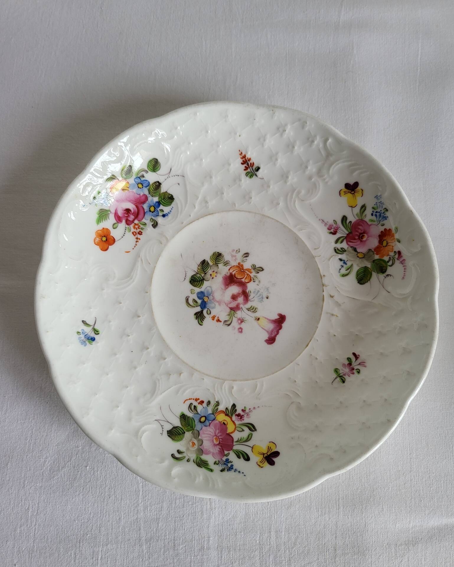 Antique Cup and Saucer in Porcelain with Hand-Painted Floral Decoration