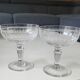 Lot of 4 x Champagne Coupes in Baccarat crystal. Engraved decoration with Greek friezes.