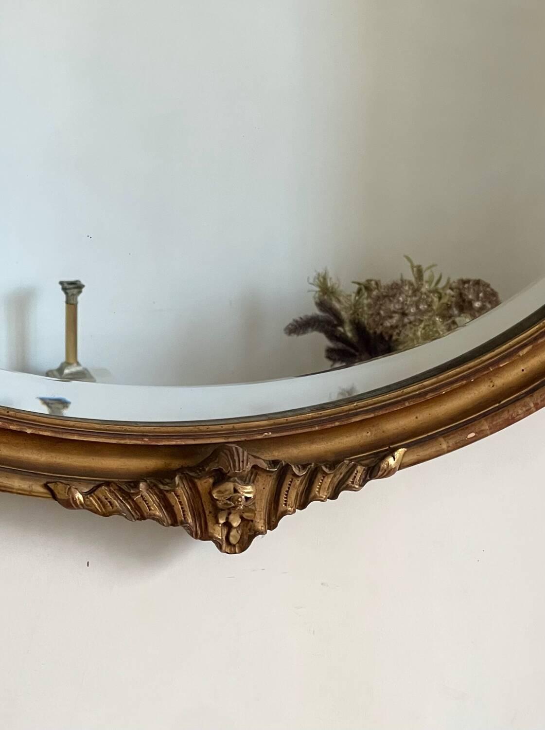 Antique oval gilt mirror.