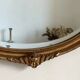 Antique oval gilt mirror.