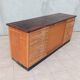Workshop furniture with drawers and curtain in beech and walnut.