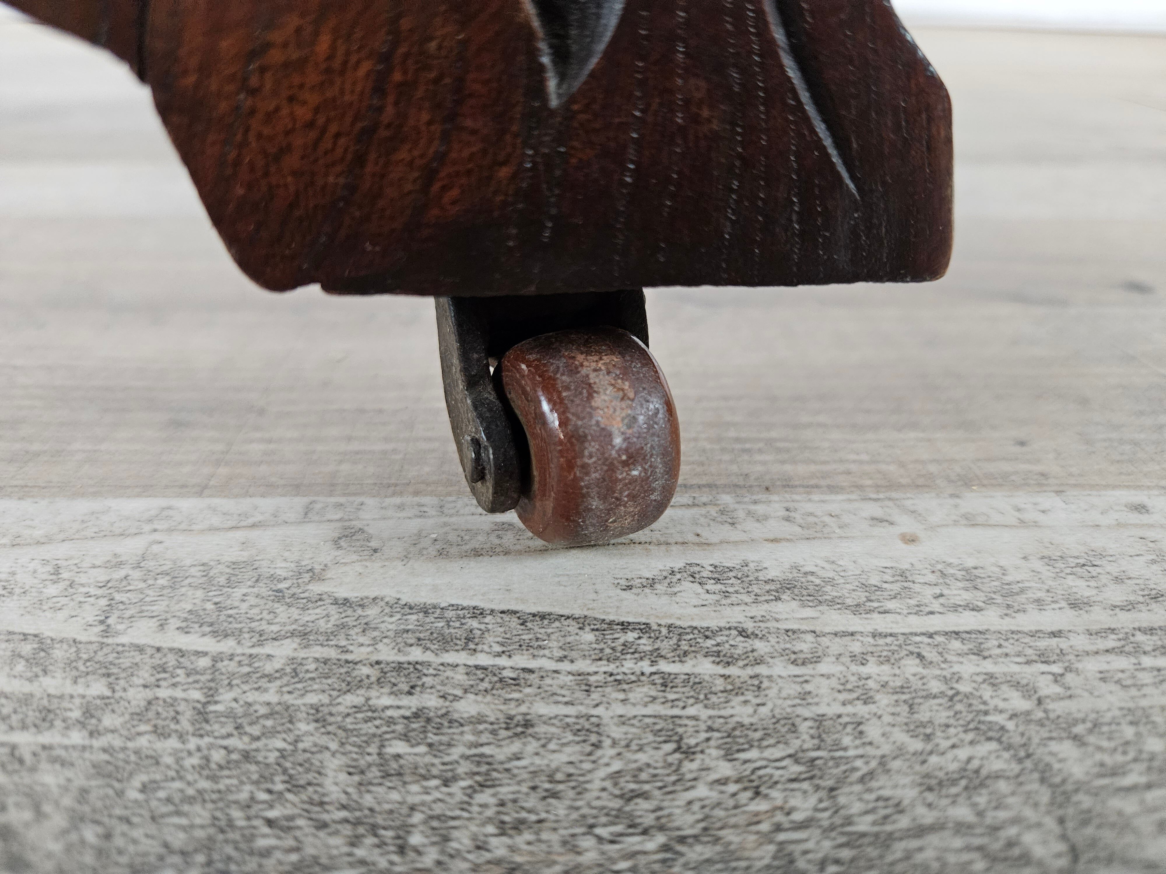 Coffee table in walnut with maple inlays and wheels