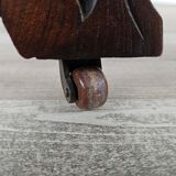 Coffee table in walnut with maple inlays and wheels