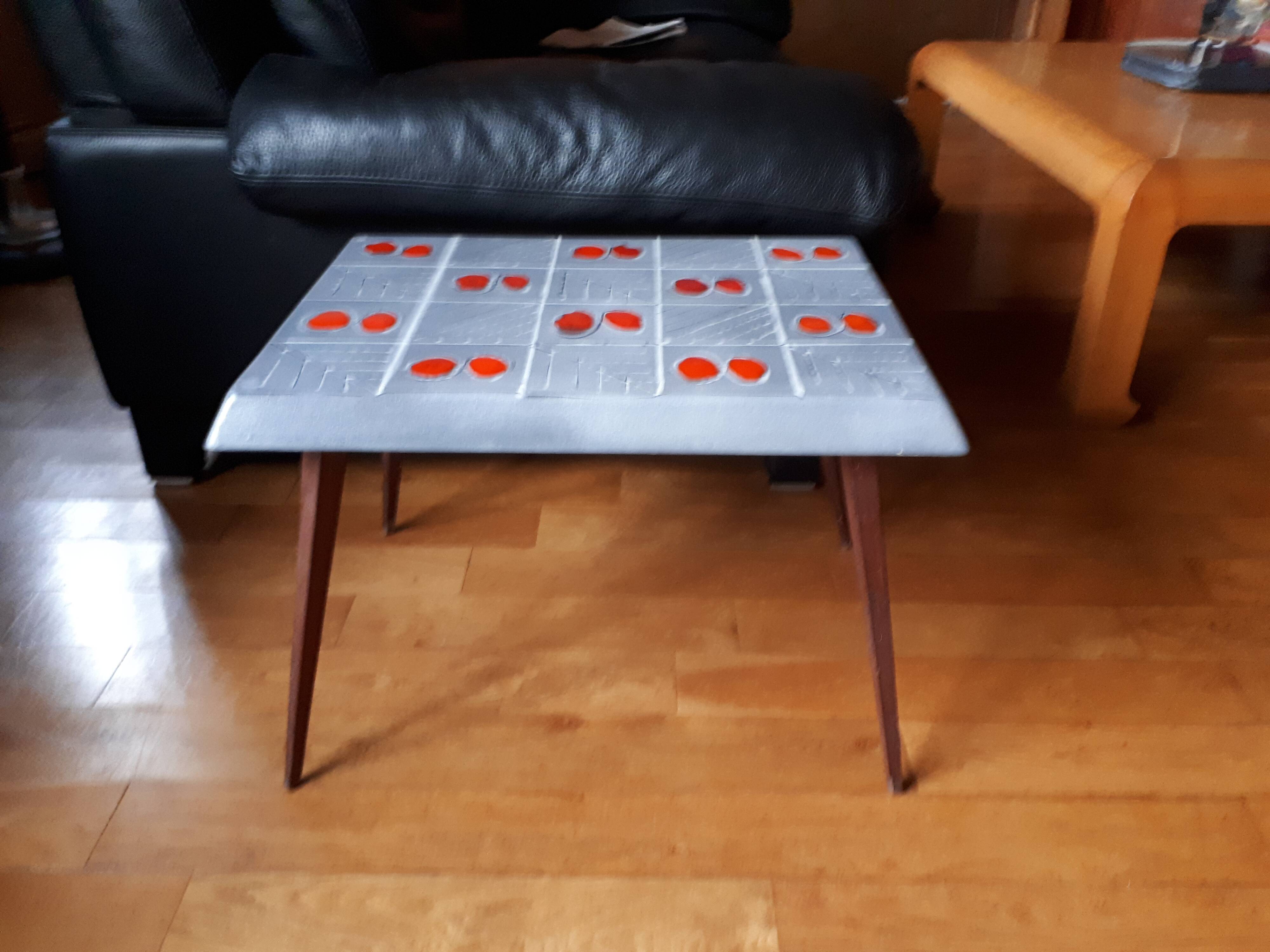 Small 1960s enamelled table, spindle legs, signed jd.
