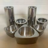 Seven different metal candle holders