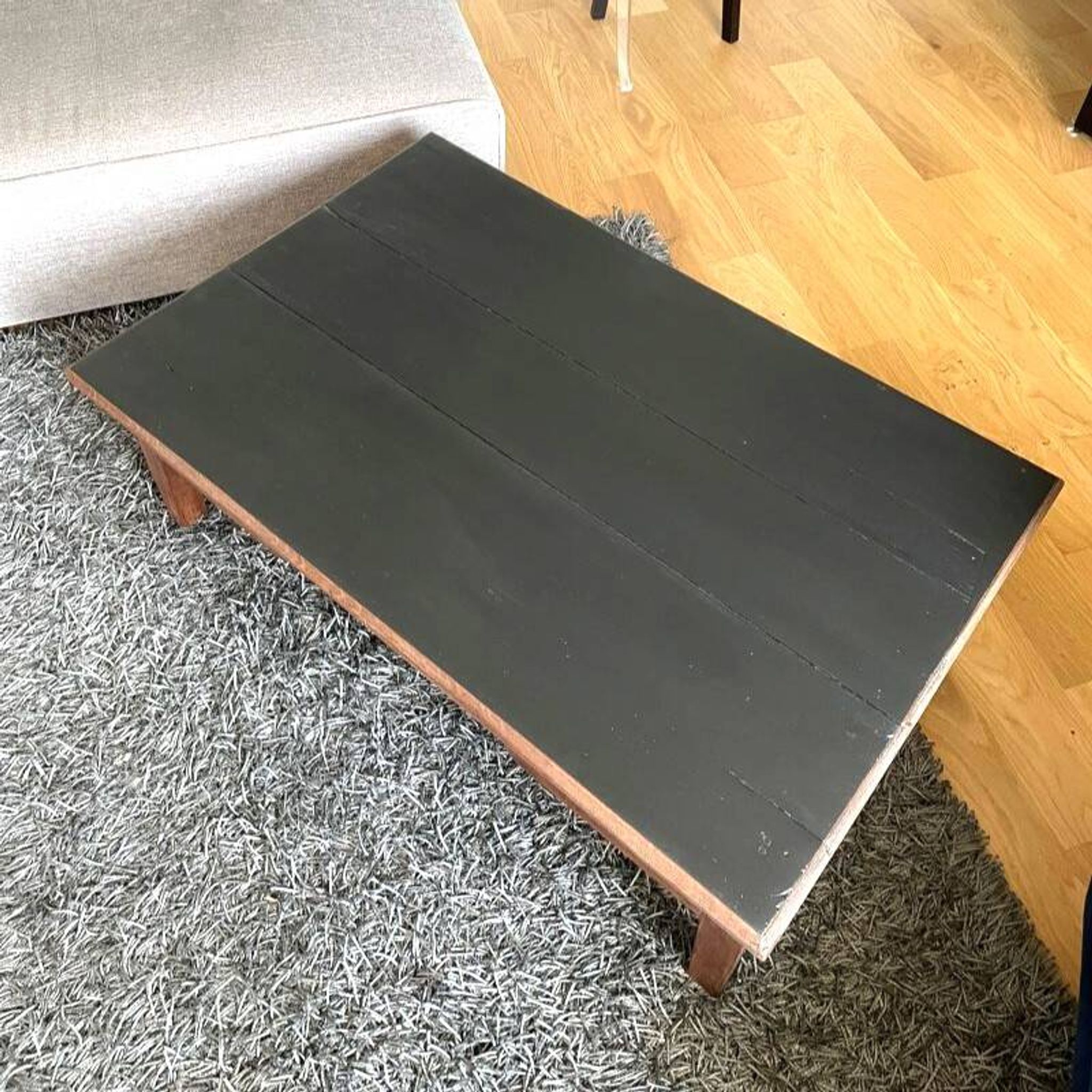 Wooden coffee table with black top