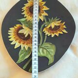 Decorative wall plate with sunflowers.