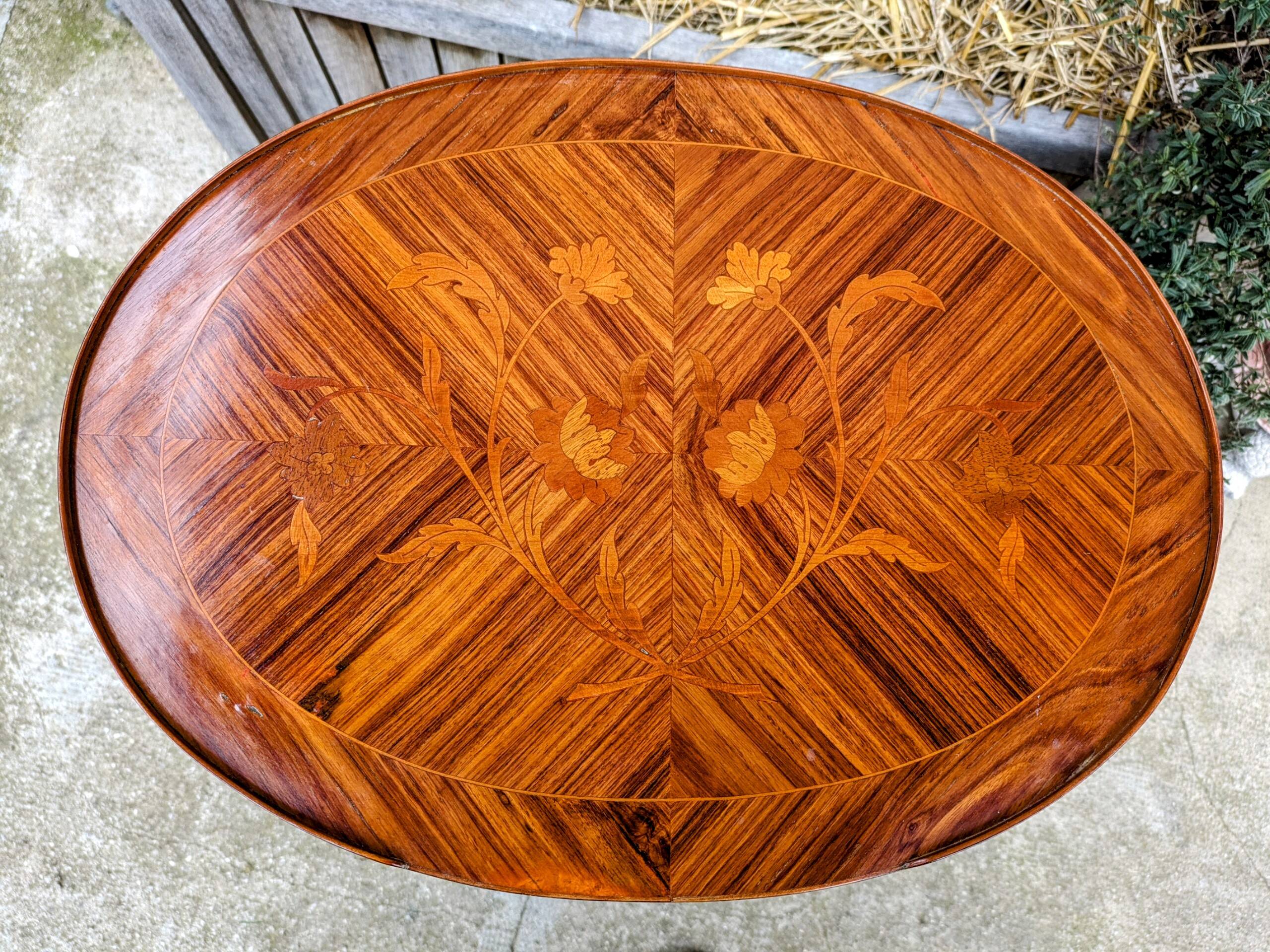 Old oval bedside table in rosewood marquetry Louis XV style