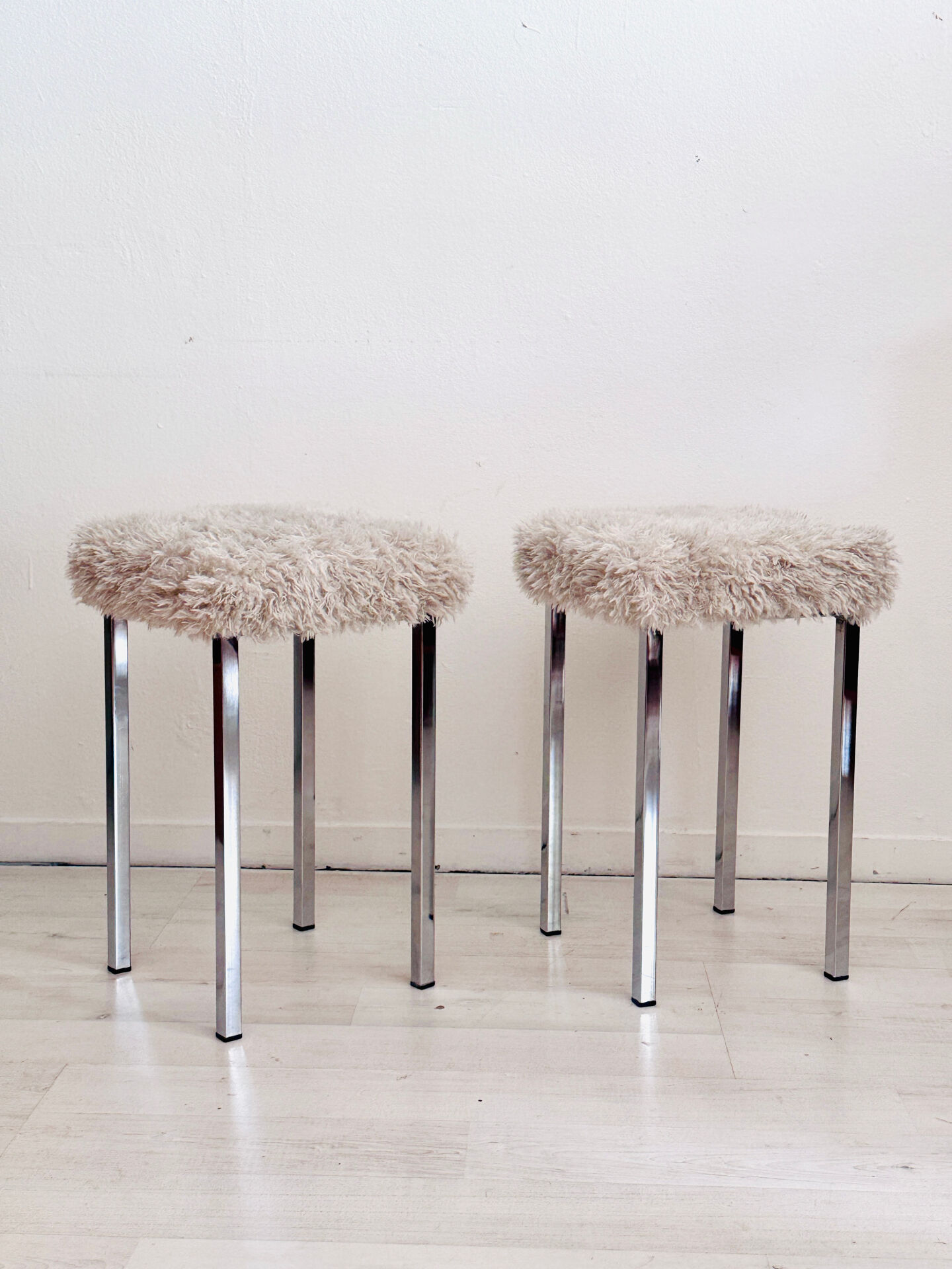 Set of two vintage chrome stools with fluffy upholstery