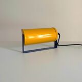 Adjustable wall lamp in yellow and blue.