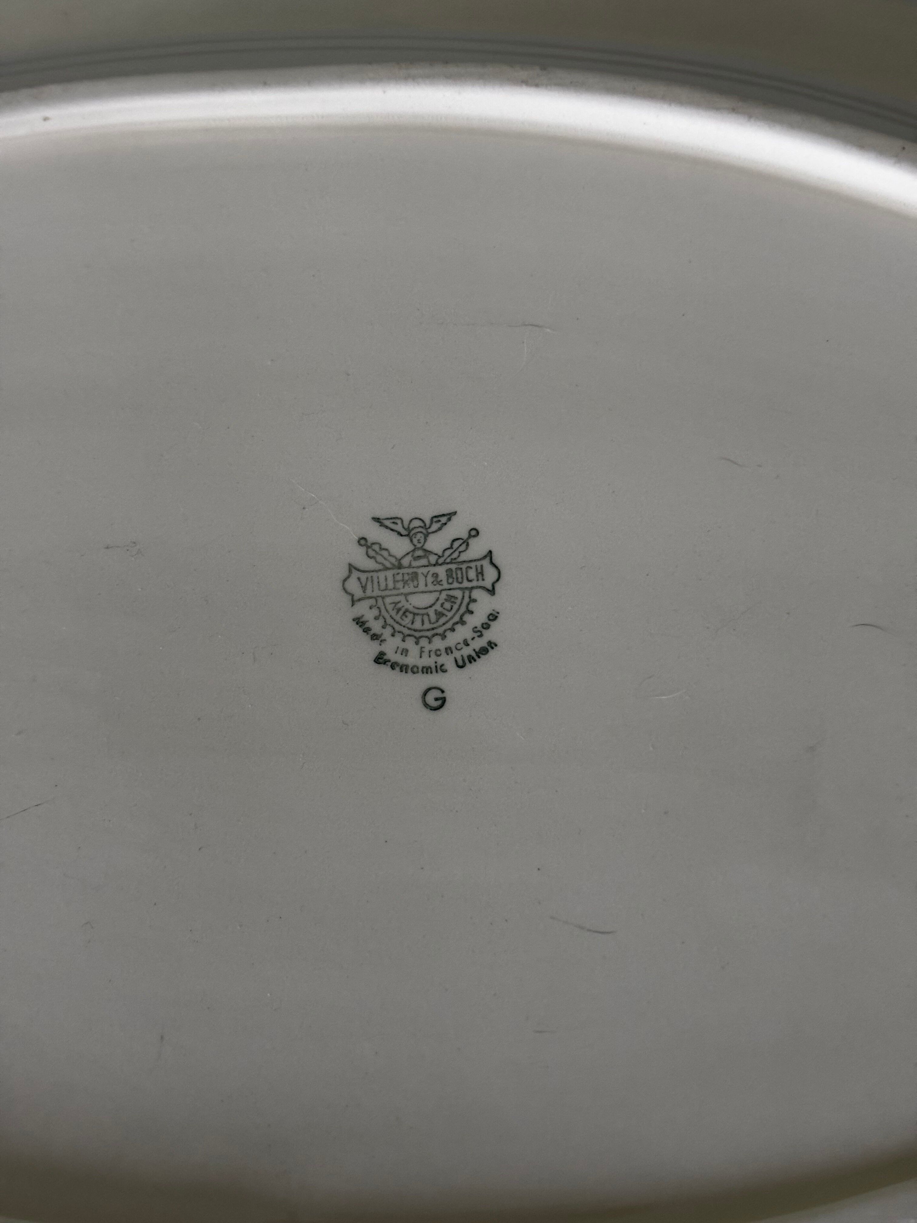 Old very large serving platter with scalloped edges by Villeroy and Boch.
