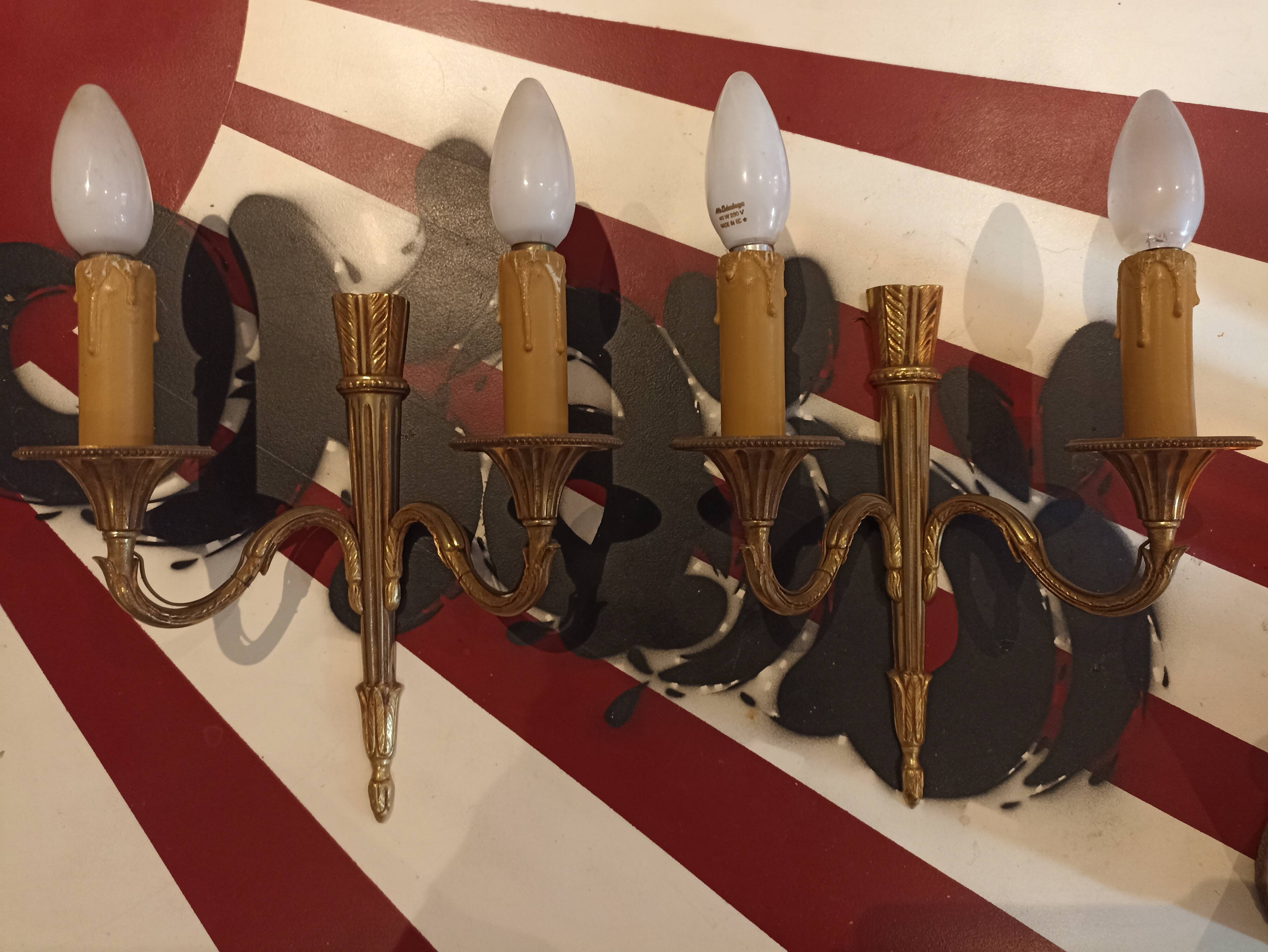 Pair of golden metal candlestick wall lamps