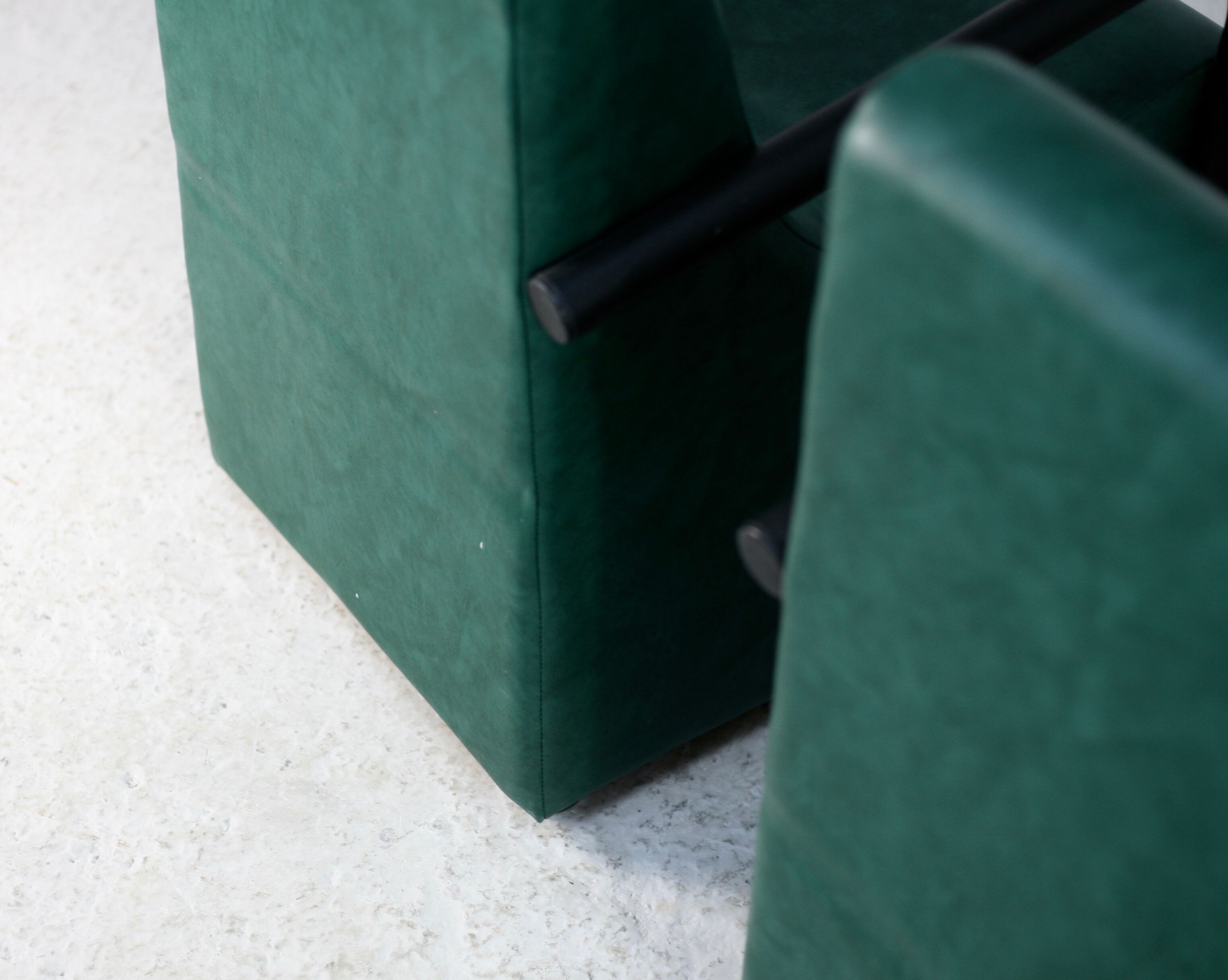 Pair of armrest heaters. Steel and green imitation leather. France, circa 1980