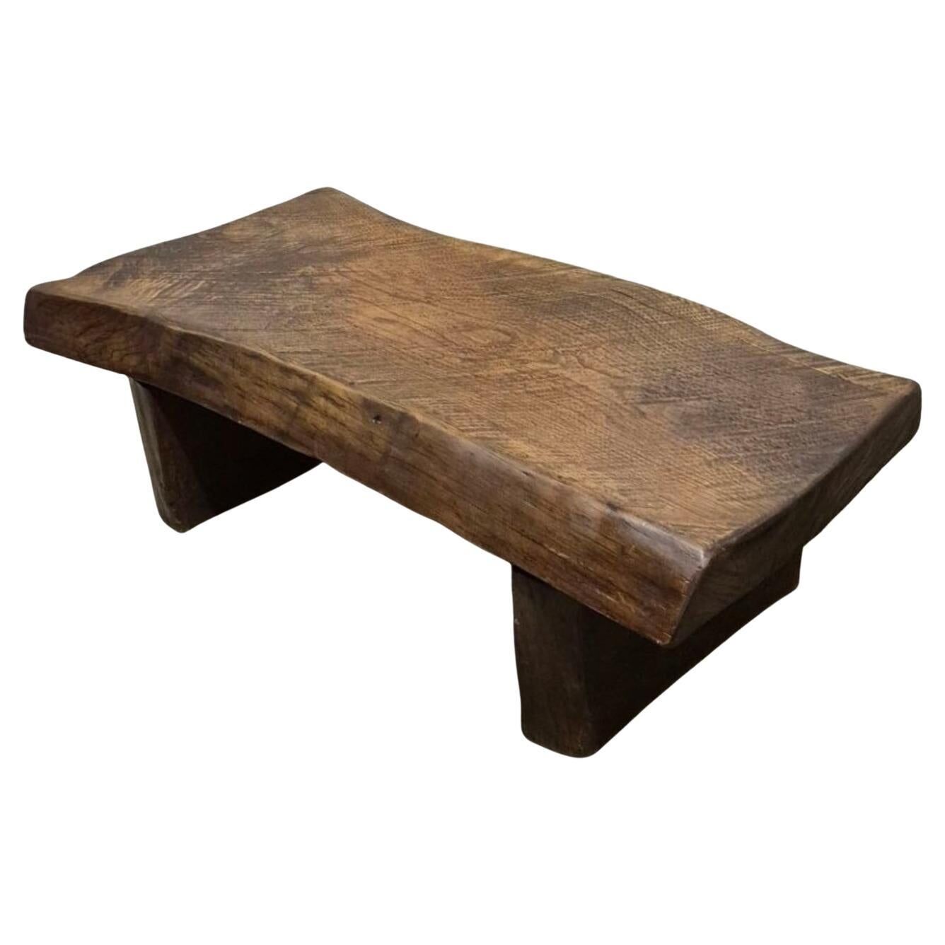 Rustic solid oak coffee table with a one piece top, France 1950s